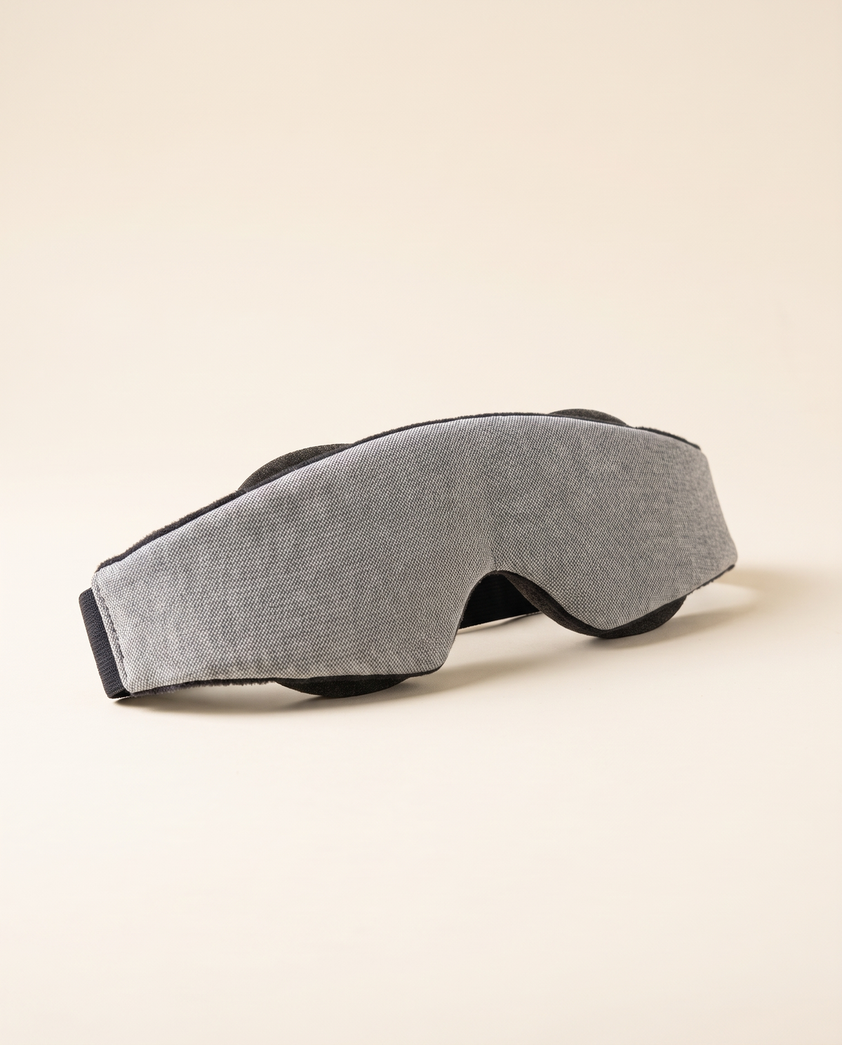 DAYBLIND 3D contour blackout mask on a cream background