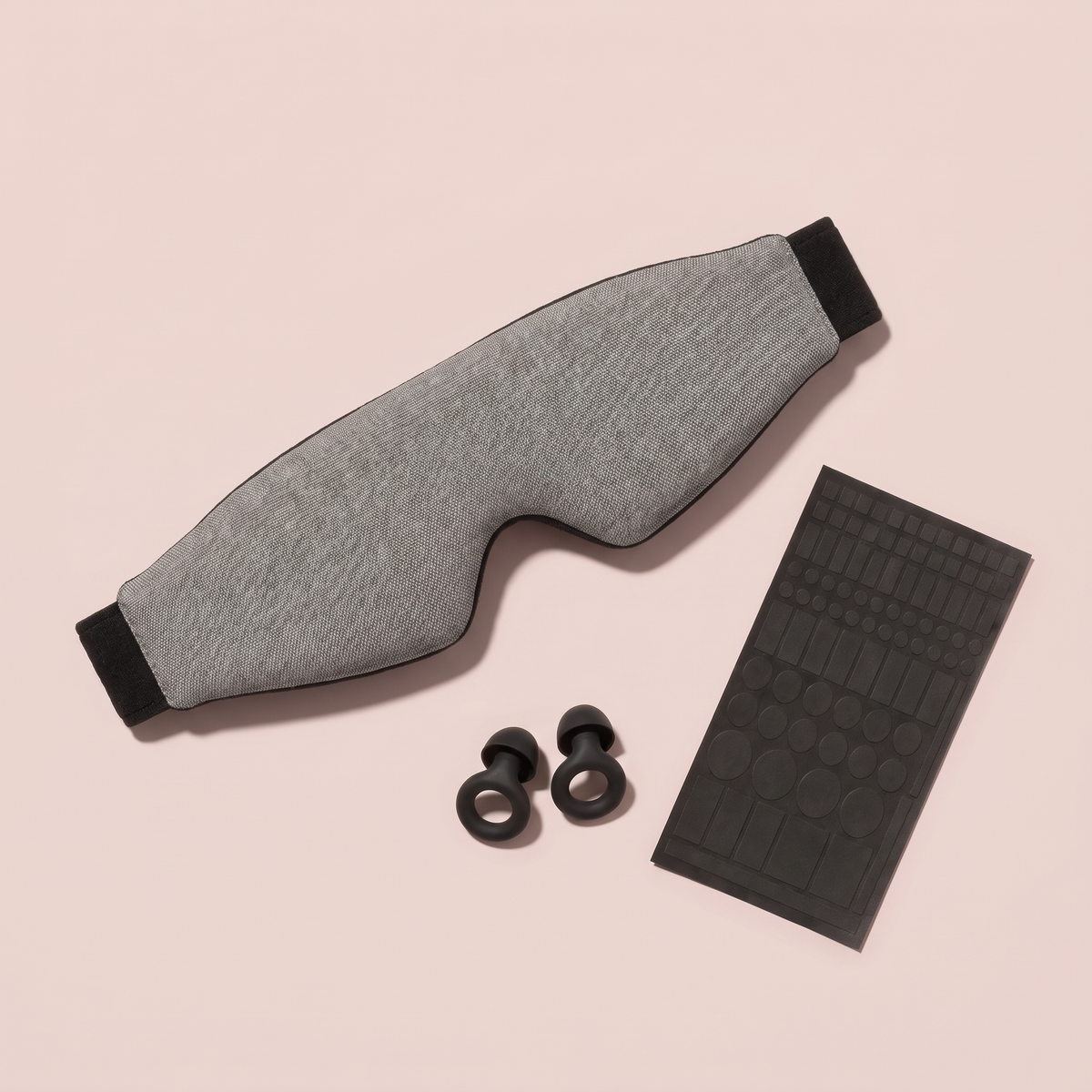 Day Sleep Kit, flat lay: mask, earplugs, stickers