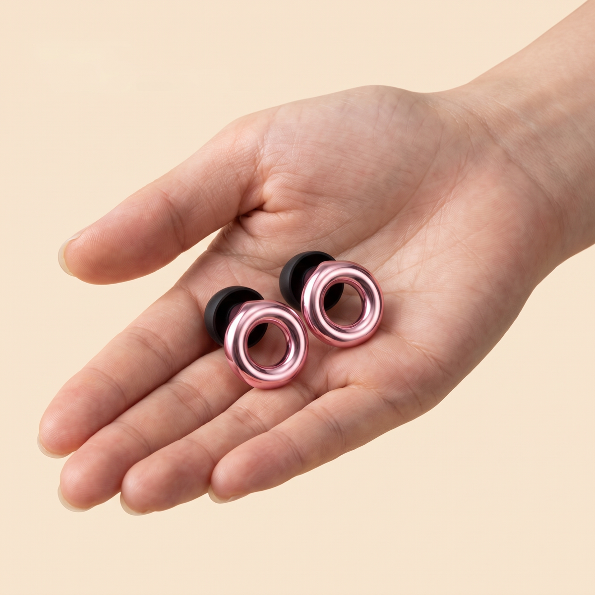 Metal Edition Earplugs in Rose Gold, in hand