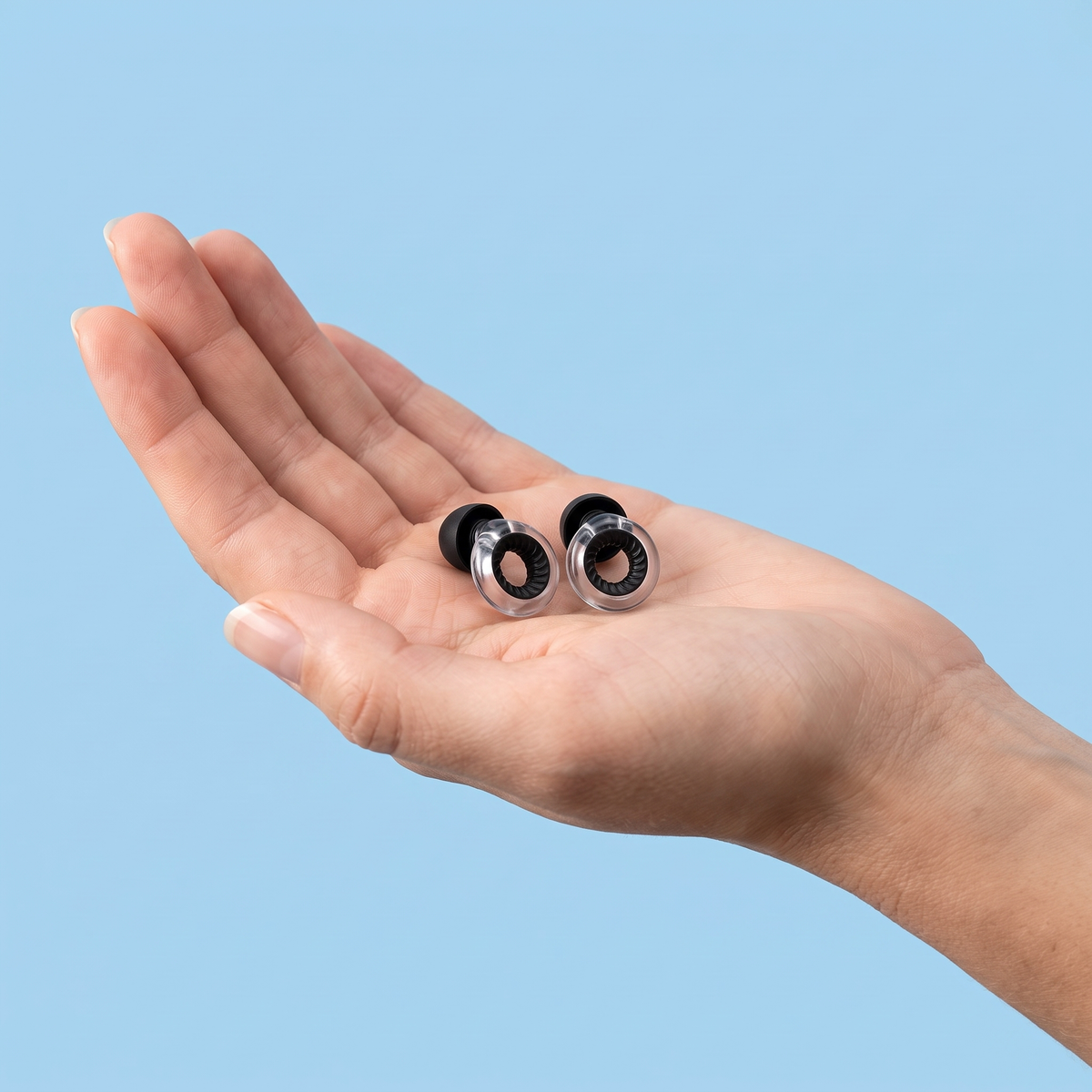 Ring Earplugs in Clear Black, in hand