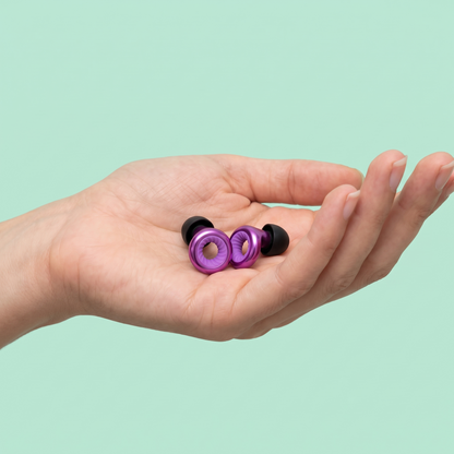 Ring Earplugs in Purple, in hand